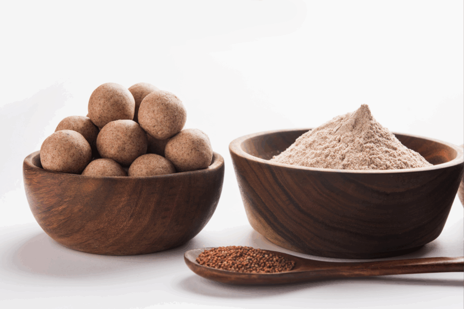 Ragi in three forms – whole grains, sprouted flour, and ladoos – displayed in wooden bowls and spoon, showcasing its nutrition and versatility.